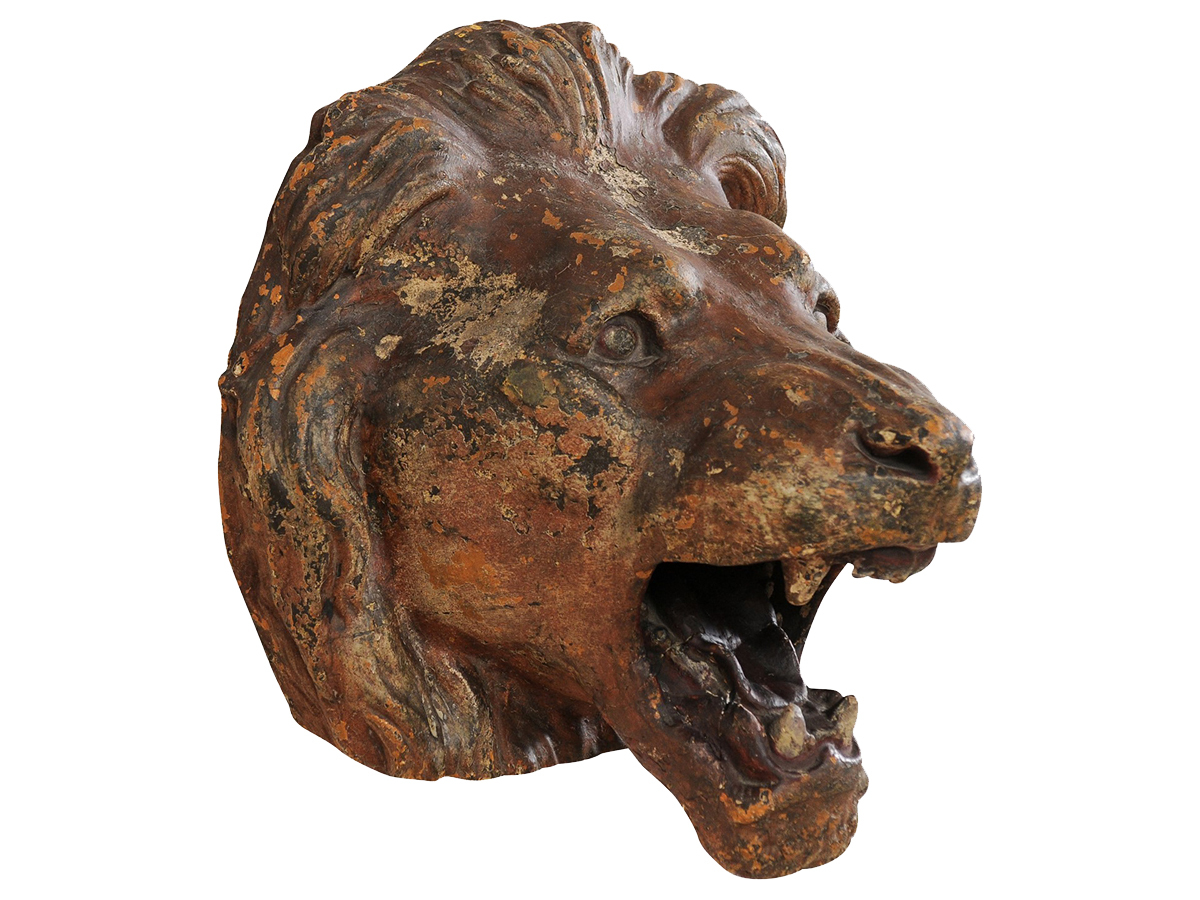 A Terracotta Lion's Head Wall Plaque